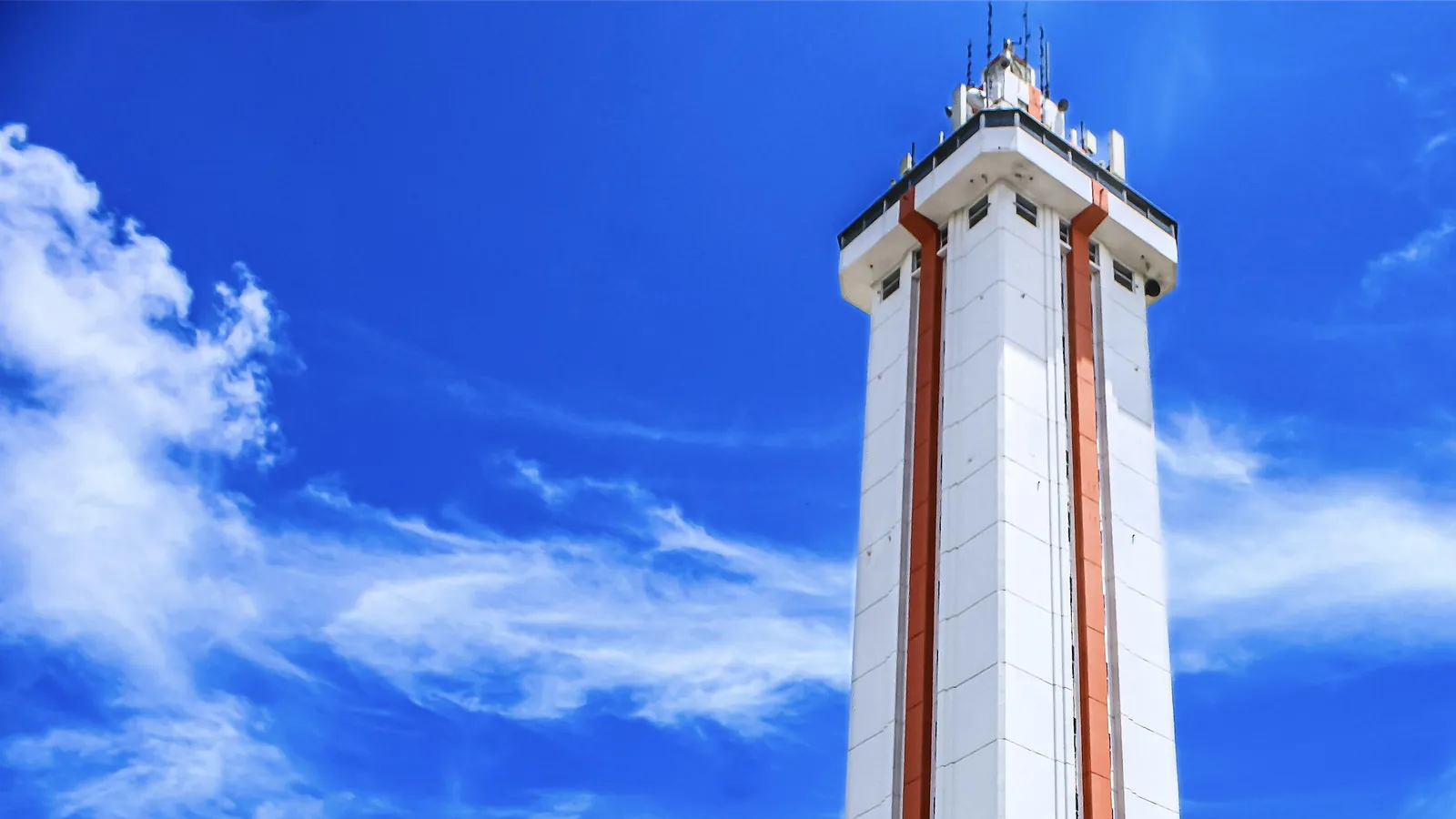 The Citrus Tower in Clermont against a bright blue sky with white clouds