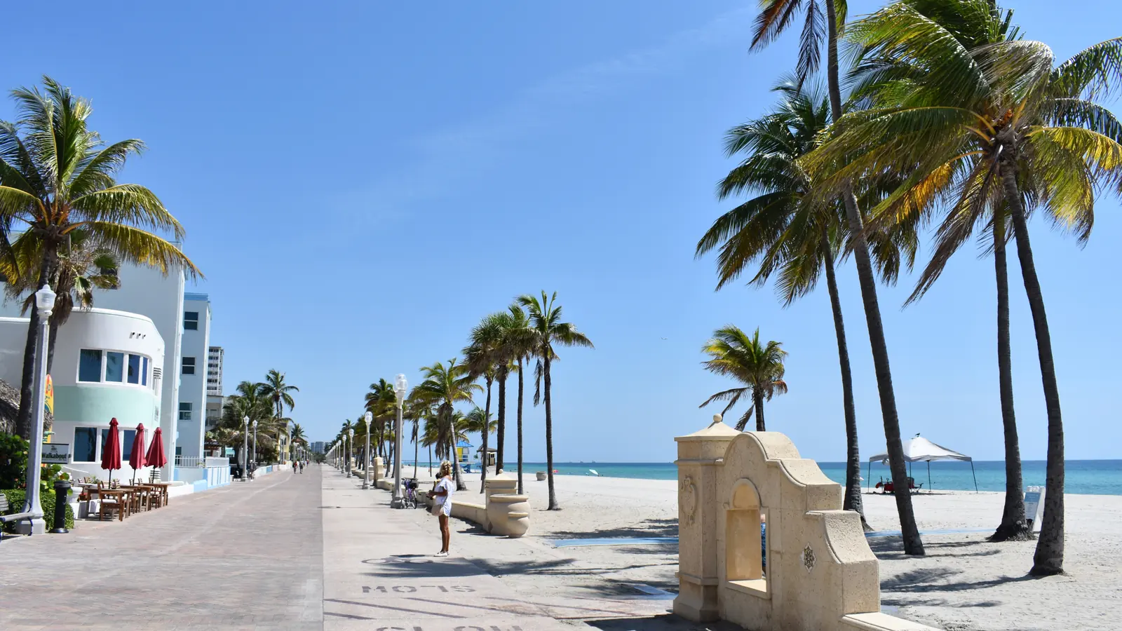 The Hollywood Beach Broadwalk with palm trees along the ocean in Hollywood, Florida