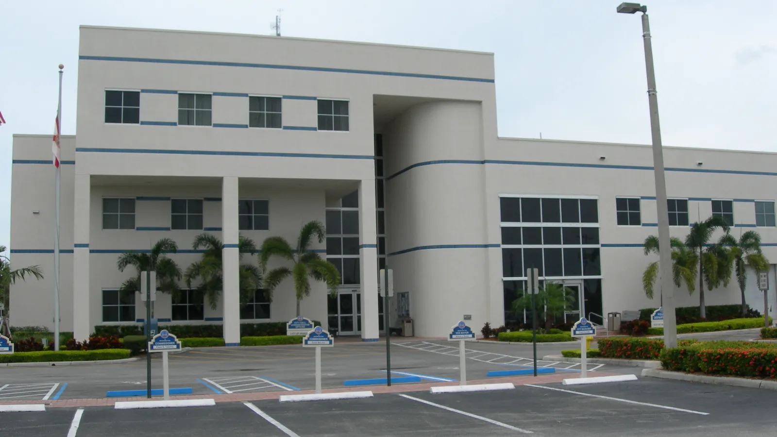 Margate City Hall, a white municipal building with palm trees, in Margate, Florida