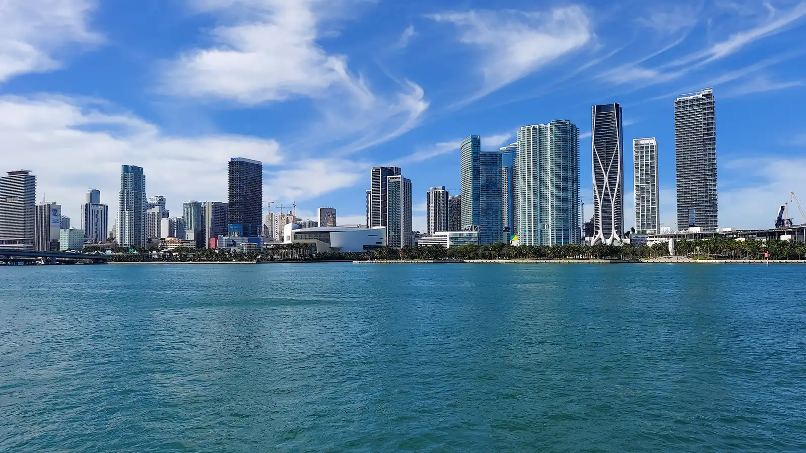 The downtown Miami skyline seen across Biscayne Bay on a sunny day