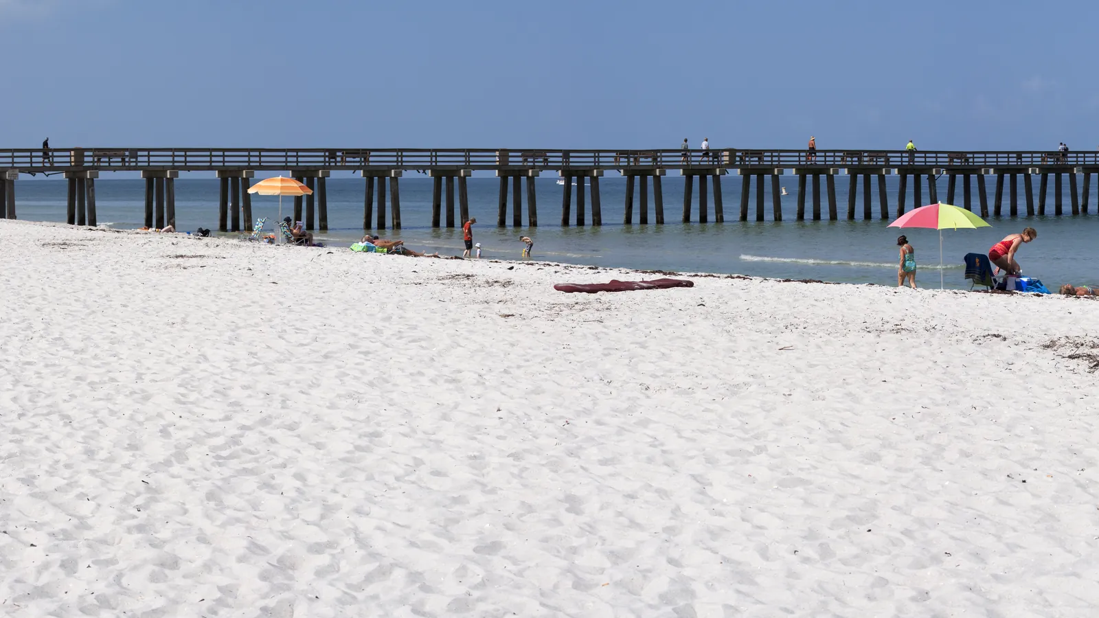 Naples Pier extending into the Gulf of Mexico in Naples, Florida