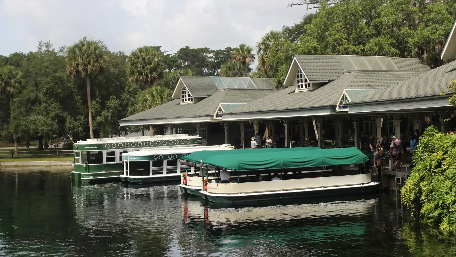 Glass-bottom boats docked along the spring at Silver Springs State Park near Ocala