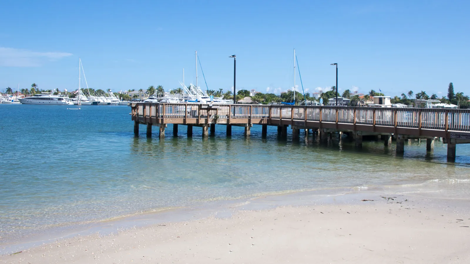 A small pier and beach at Peanut Island Park, near Riviera Beach, Florida