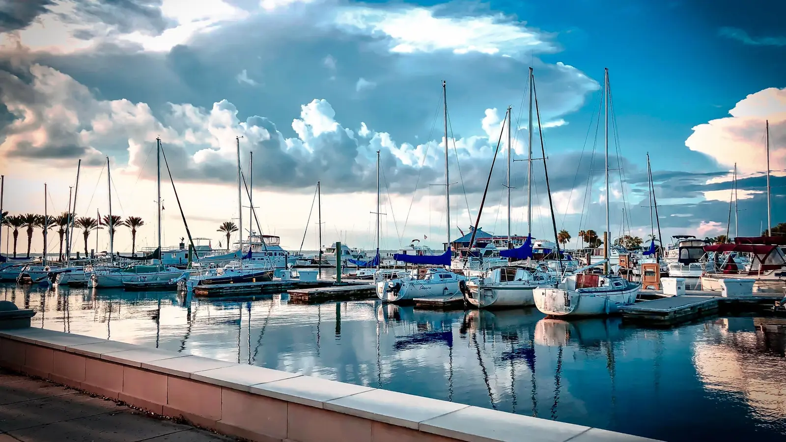 Sailboats docked at the Sanford marina on Lake Monroe under dramatic clouds