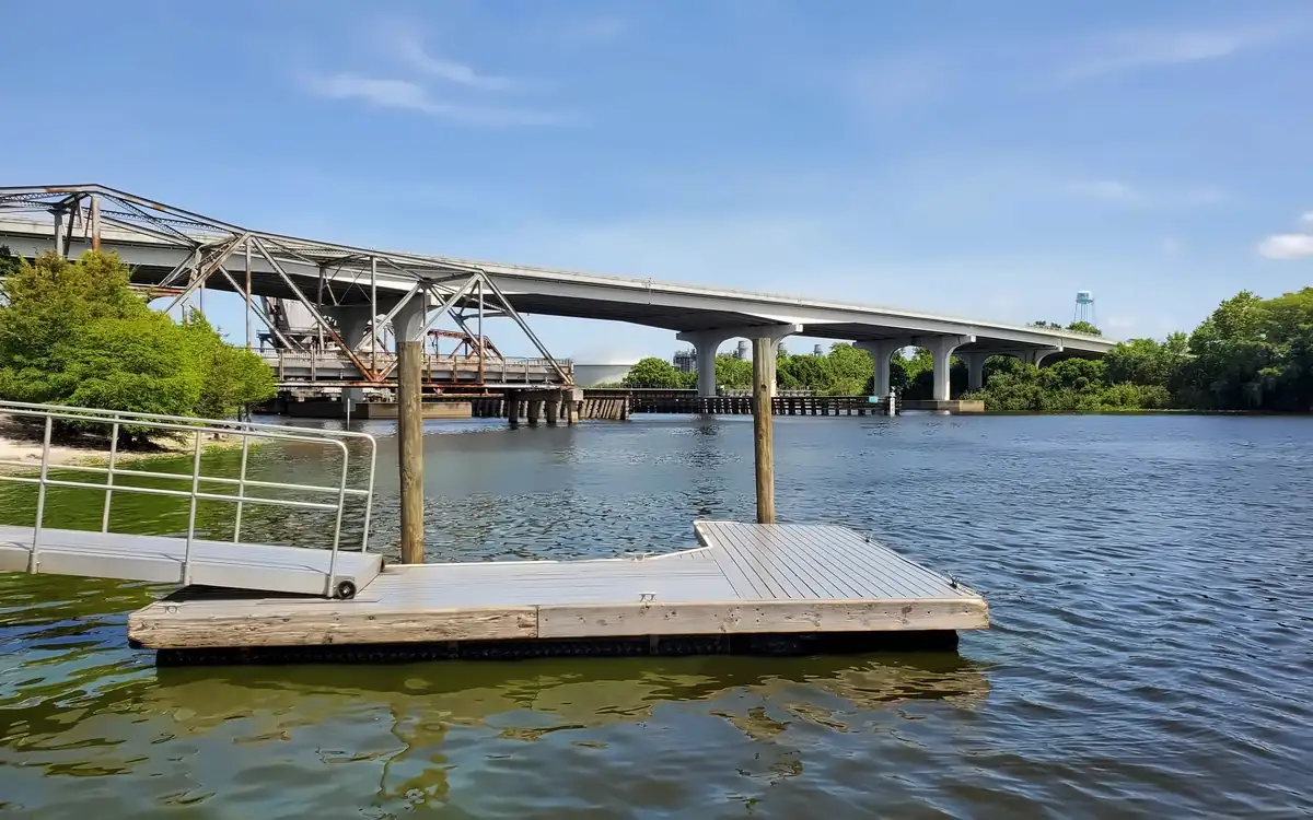 Floating dock on the St. Johns River in Sanford with a bridge in the background