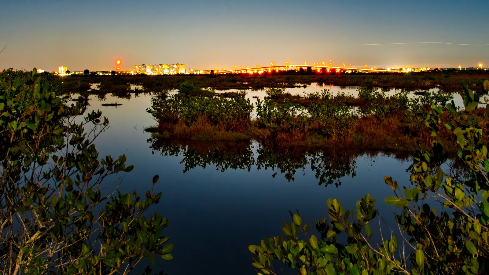The Indian River at dusk near the Max Brewer Bridge in Titusville, Florida